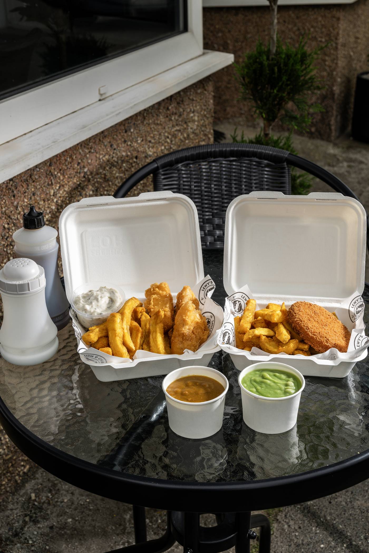 Two takeaway boxes from Lewy's β fish, chips and chicken