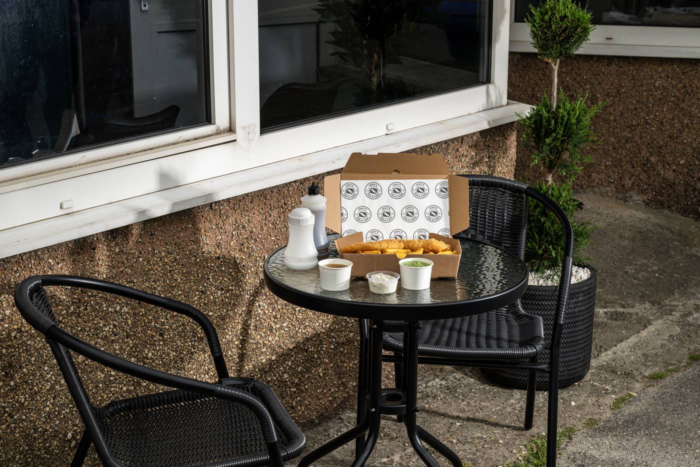 Outdoor table at Lewy's with a takeaway box